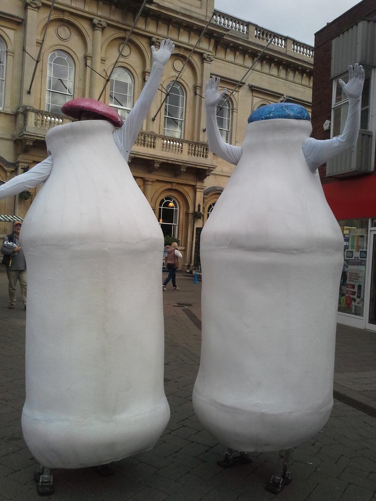 milk bottle stilt walkers (flam)